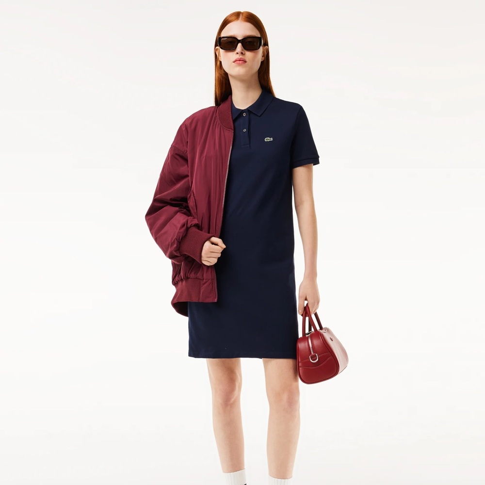 Women’s Lacoste short sleeved Pique knit polo dress in black.